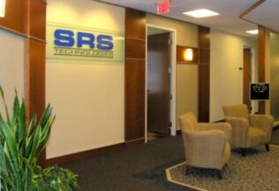 Reception Area, Glass Logo Sign, Cherry Wall Paneling, Accent Carpets, Arlington, VA